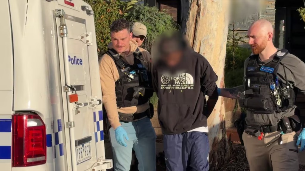 Police arresting one of the accused teens over the Melbourne CBD nightclub arson attacks